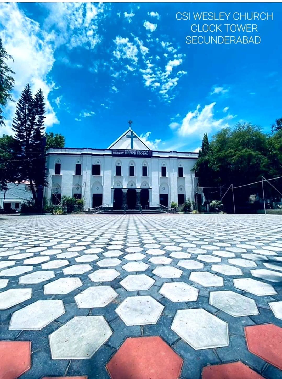 Wesley Church seen across its hexagon-paved forecourt